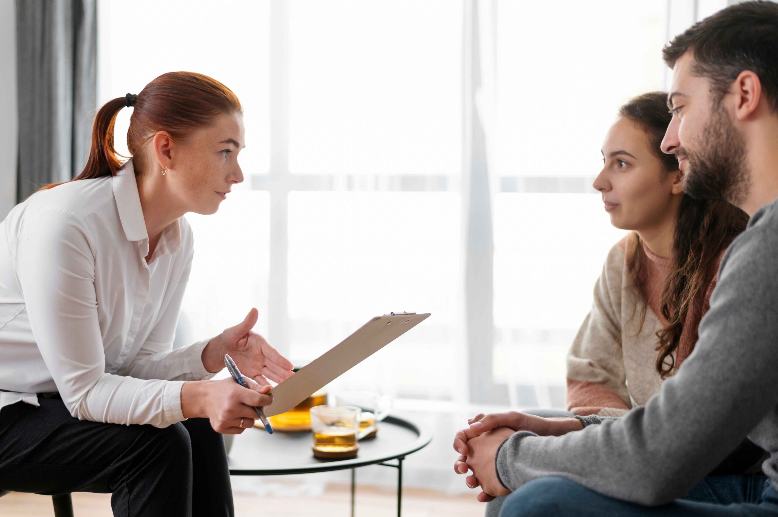 close-up-people-discussing-with-therapist_11zon