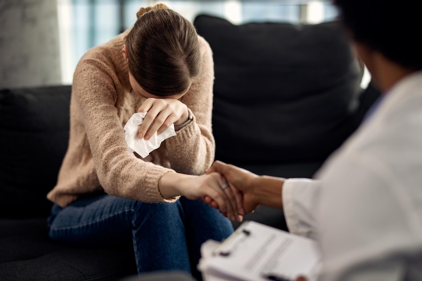 depressed-woman-seeking-solace-from-her-psychotherapist_637285-9919